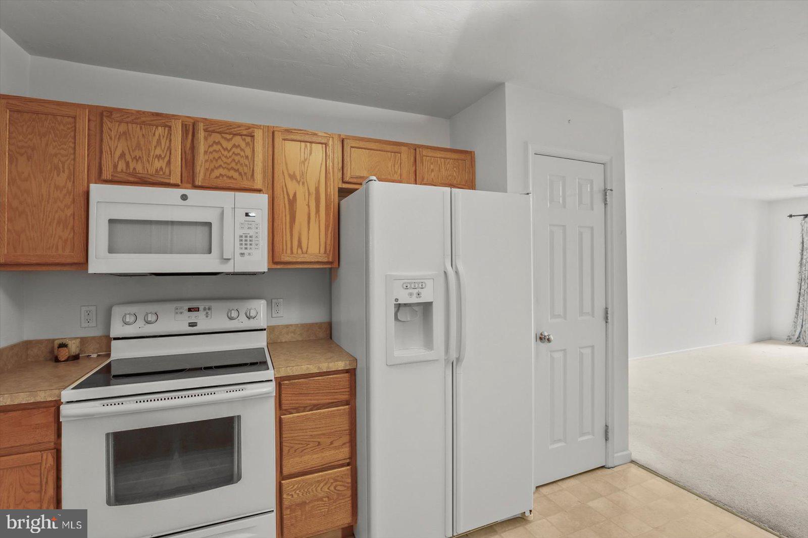 7150 Seneca Ridge Drive York, PA 17403 - Photo 12 of 32 a kitchen with stainless steel appliances white cabinets and a refrigerator