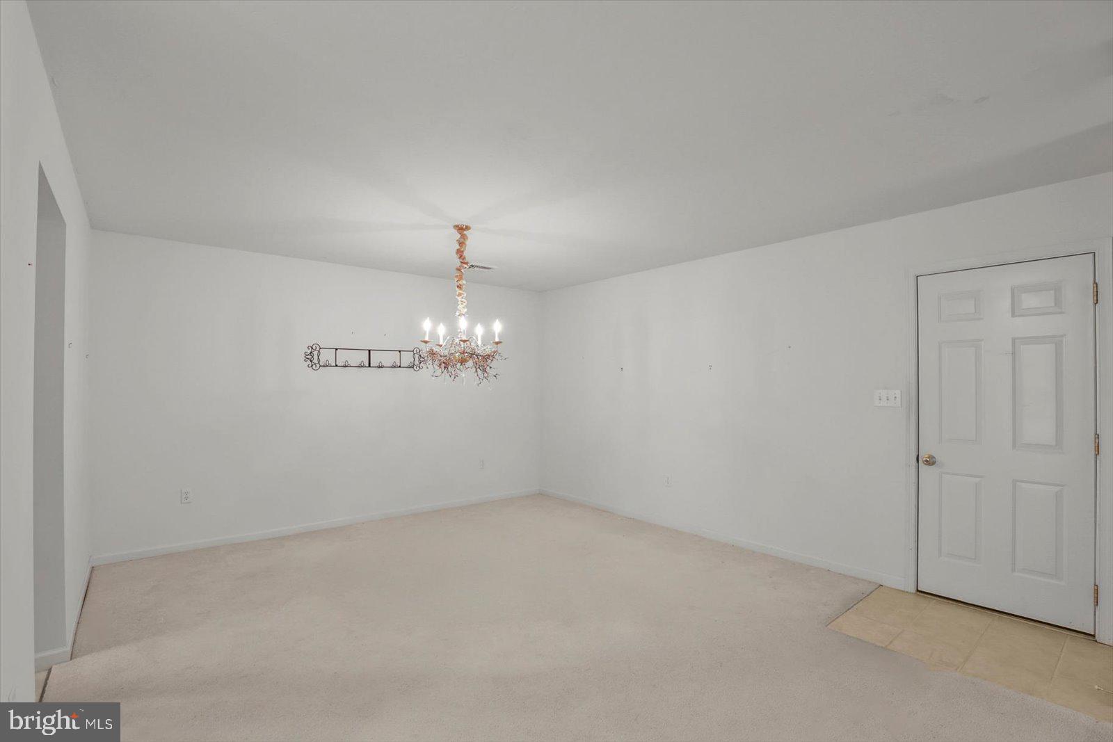 7150 Seneca Ridge Drive York, PA 17403 - Photo 9 of 32 an empty room with chandelier fan