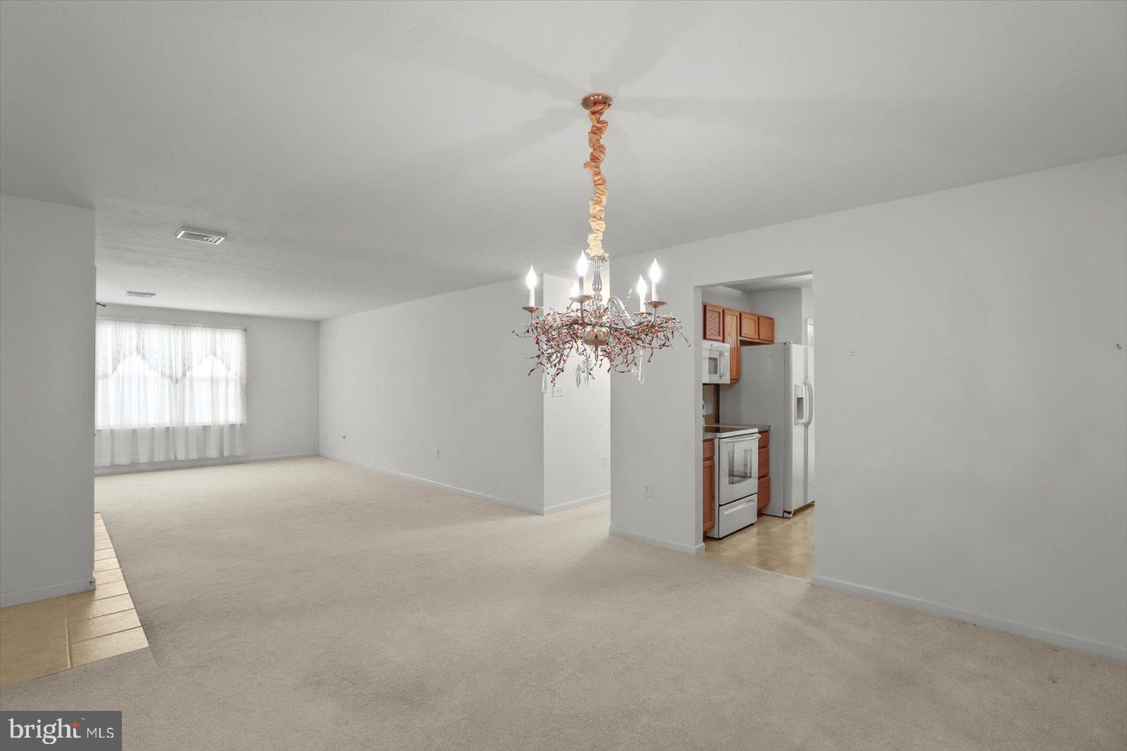7150 Seneca Ridge Drive York, PA 17403 - Photo 10 of 32 a view of a chandelier in big room and chandelier