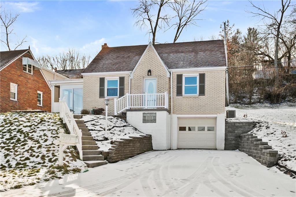 a view of front of house with a yard