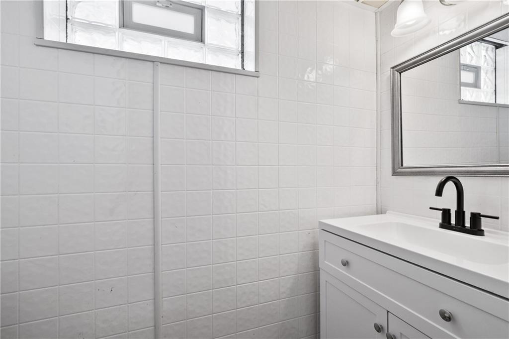 3593 Middleboro Road Pittsburgh, PA 15234 - Photo 16 of 20 a bathroom with a sink and a mirror