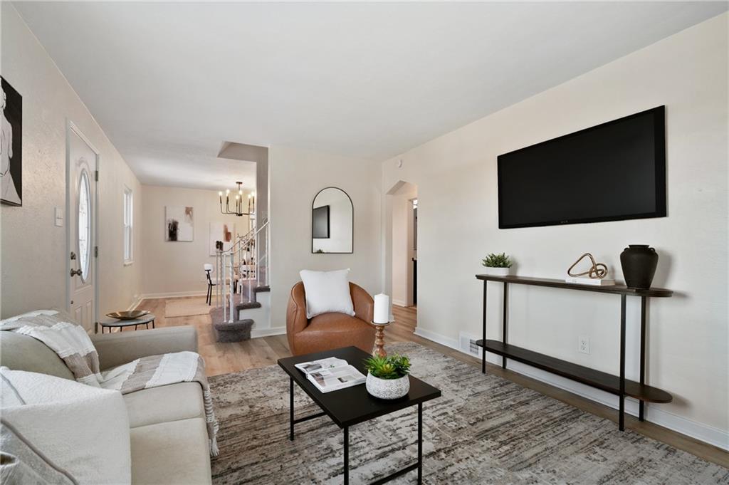 3593 Middleboro Road Pittsburgh, PA 15234 - Photo 3 of 20 a living room with furniture and a flat screen tv
