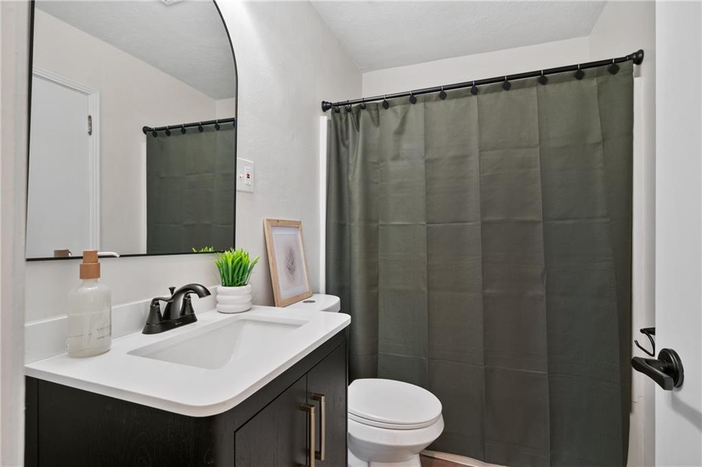 3593 Middleboro Road Pittsburgh, PA 15234 - Photo 8 of 20 a bathroom with a sink and a mirror