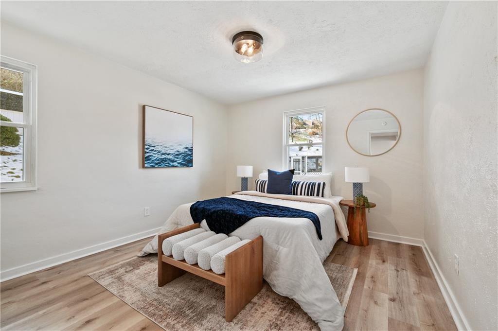 3593 Middleboro Road Pittsburgh, PA 15234 - Photo 9 of 20 a bedroom with a bed and a window