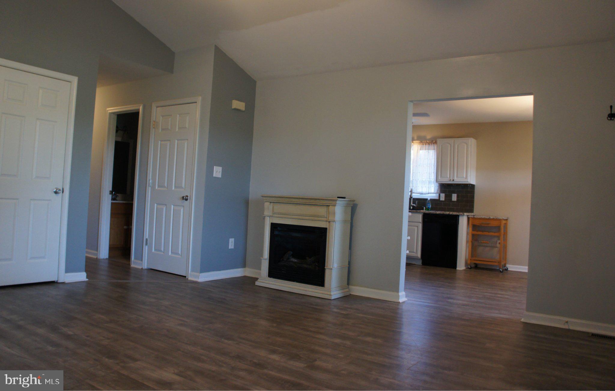 8981 Sharptown Road Laurel, DE 19956 - Photo 10 of 34 Spacious living area with modern charm.