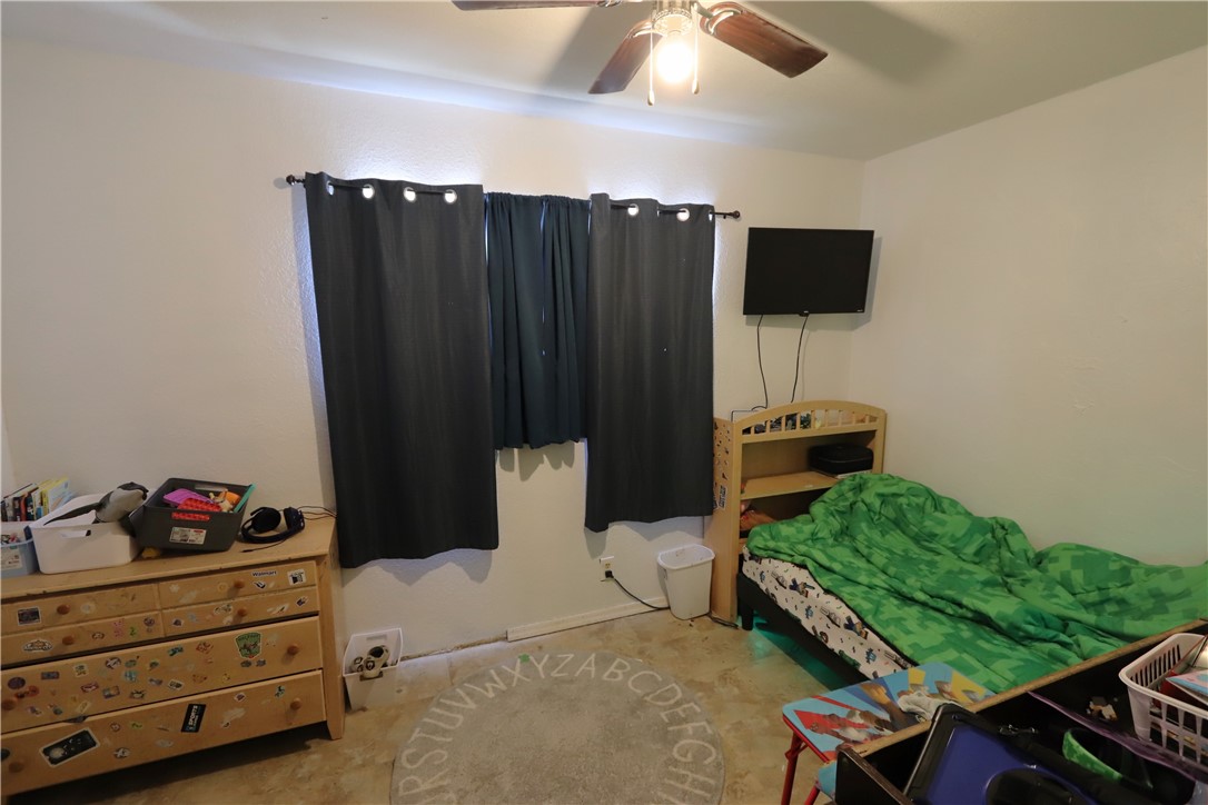 1290 Hammer Road Fort Mohave, AZ 86426 - Photo 10 of 16 Bedroom with a ceiling fan, and closet.