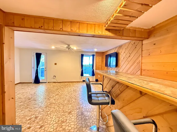 a view of a living room and bathroom