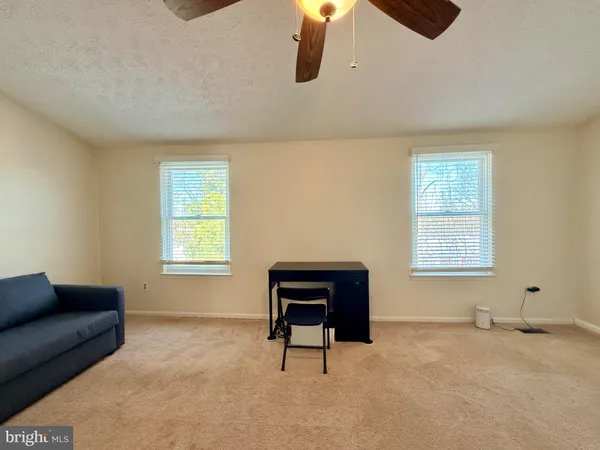 a living room with furniture and window