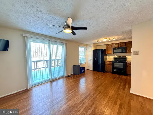 a view of large windows in an empty room