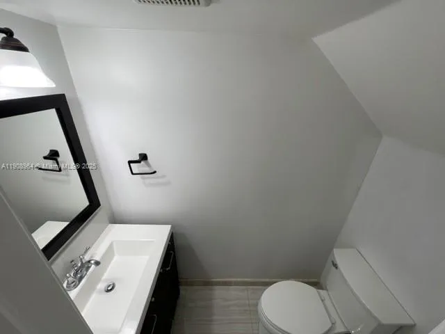 a bathroom with a toilet and a sink