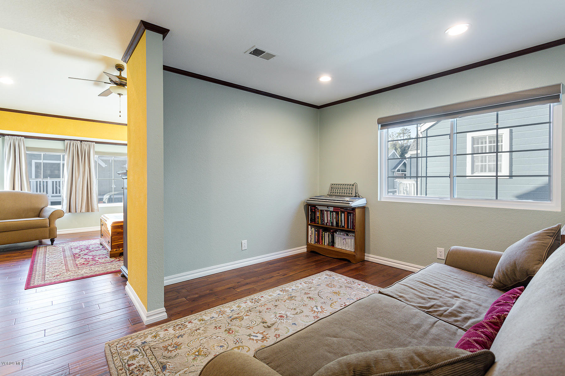 1818 Rory Lane, Unit 4 Simi Valley, CA 93063 - Photo 14 of 26 a bedroom with a bed and wooden floor