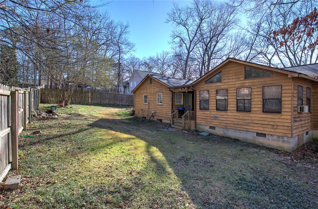 101 Ivy Lane Southeast Cartersville, GA 30121 - Photo 11 of 47 a front view of a house with a yard and garage