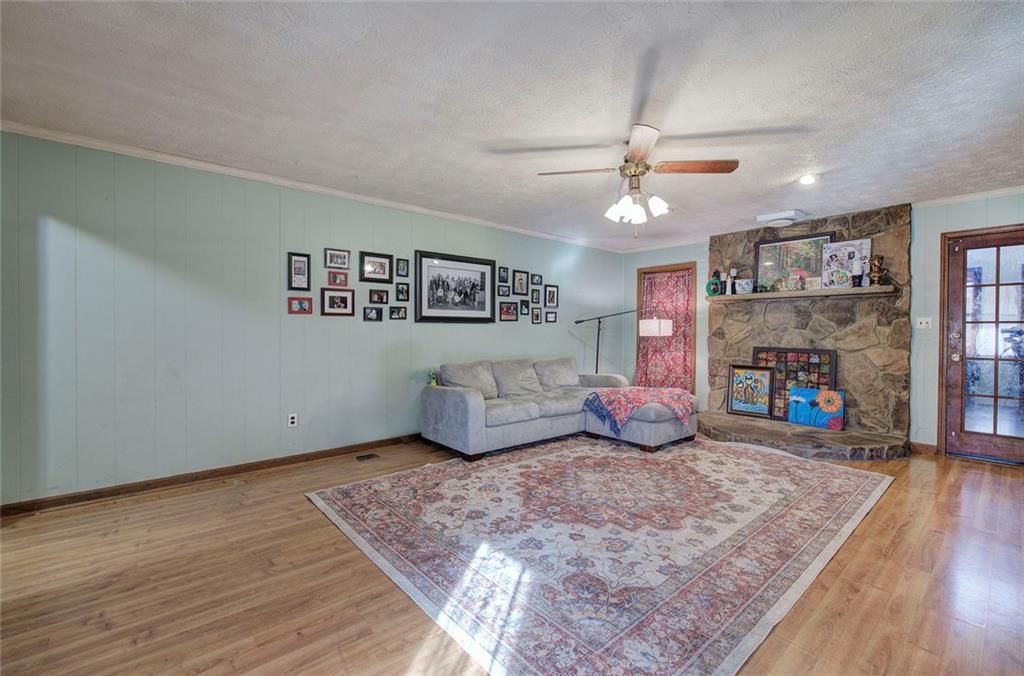101 Ivy Lane Southeast Cartersville, GA 30121 - Photo 17 of 47 a bedroom with furniture and a fireplace