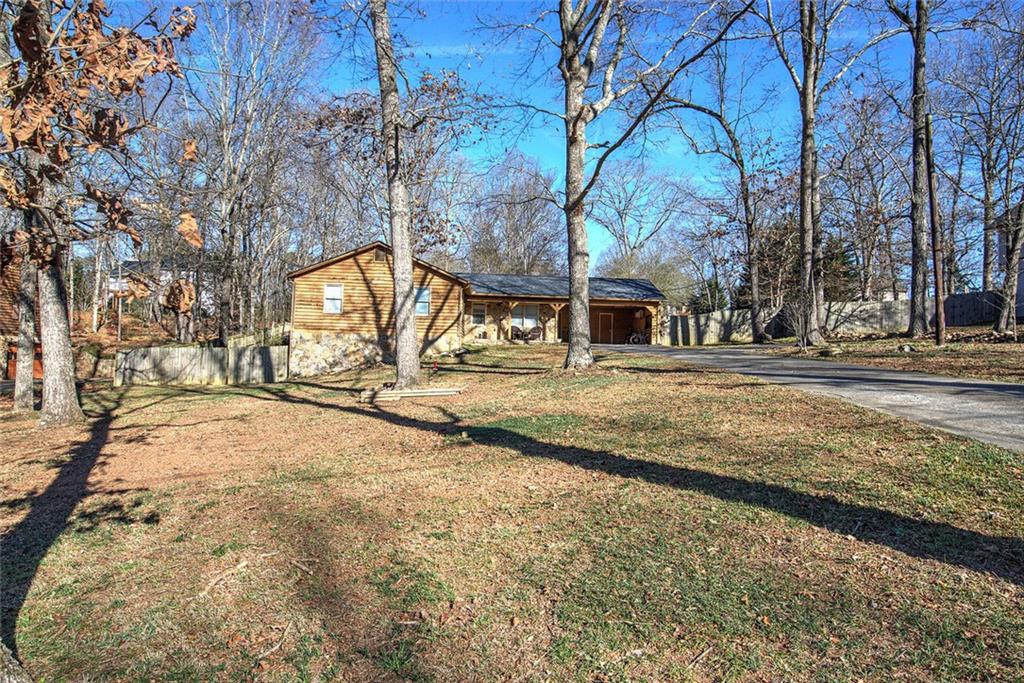 101 Ivy Lane Southeast Cartersville, GA 30121 - Photo 2 of 47 a view of road with large trees