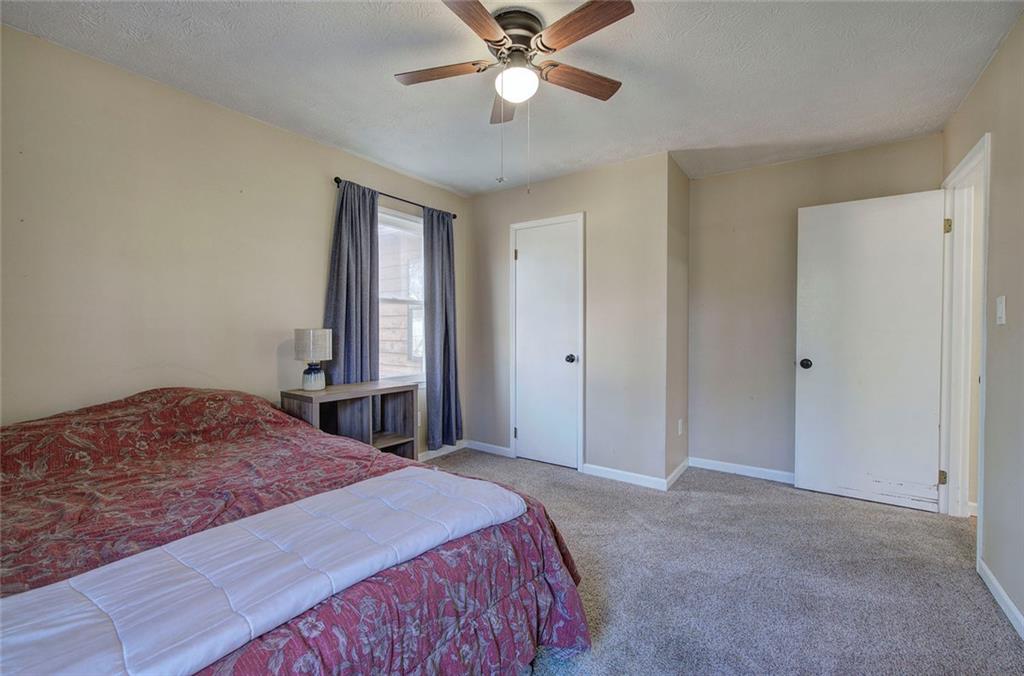 101 Ivy Lane Southeast Cartersville, GA 30121 - Photo 38 of 47 a bedroom with a bed and a chandelier