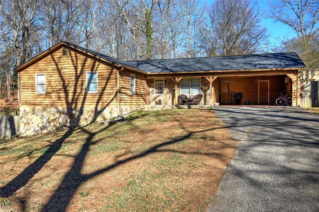 101 Ivy Lane Southeast Cartersville, GA 30121 - Photo 5 of 47 a view of a house with a backyard
