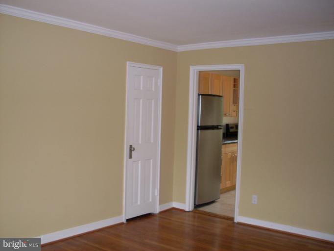 205 East Glebe Road, Unit 6205E Alexandria, VA 22305 - Photo 3 of 13 a view of a hallway with wooden floor