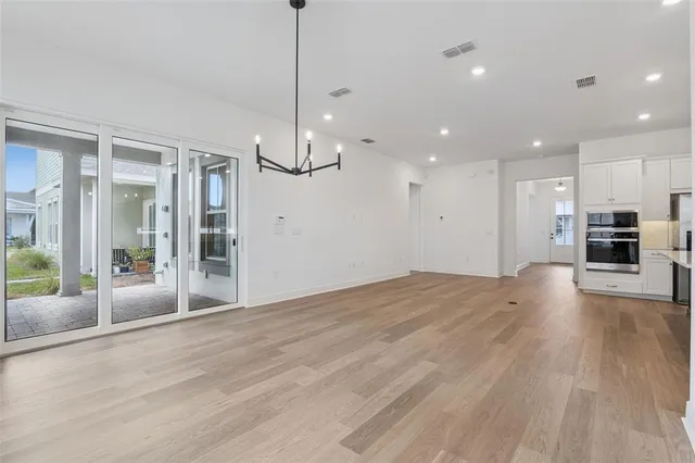 a view of a kitchen with a sink and a refrigerator