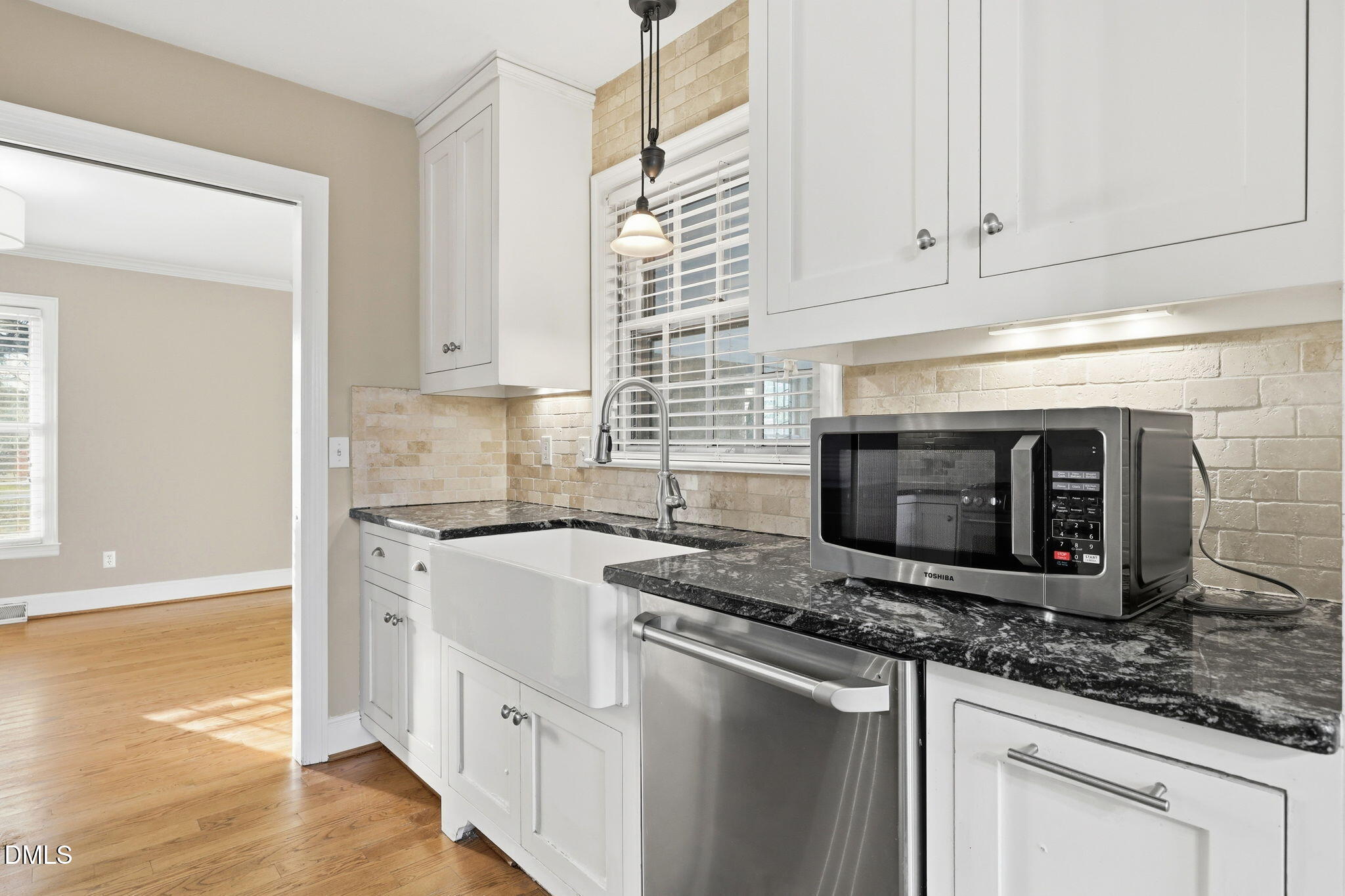 1130 Prospect Church Road Dunn, NC 28334 - Photo 12 of 47 a kitchen with stainless steel appliances granite countertop a stove a sink and a microwave