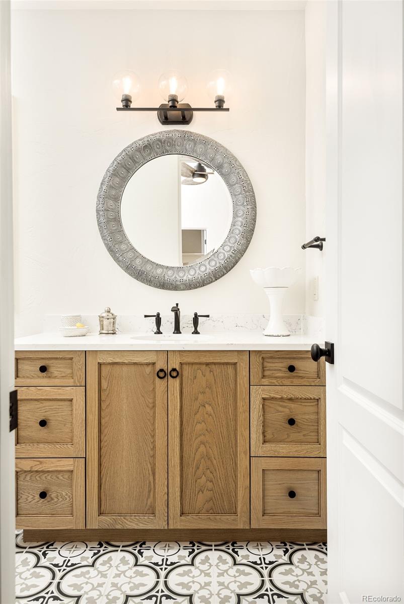 80 South Eudora Street Denver, CO 80246 - Photo 33 of 43 a bathroom with a sink and a mirror
