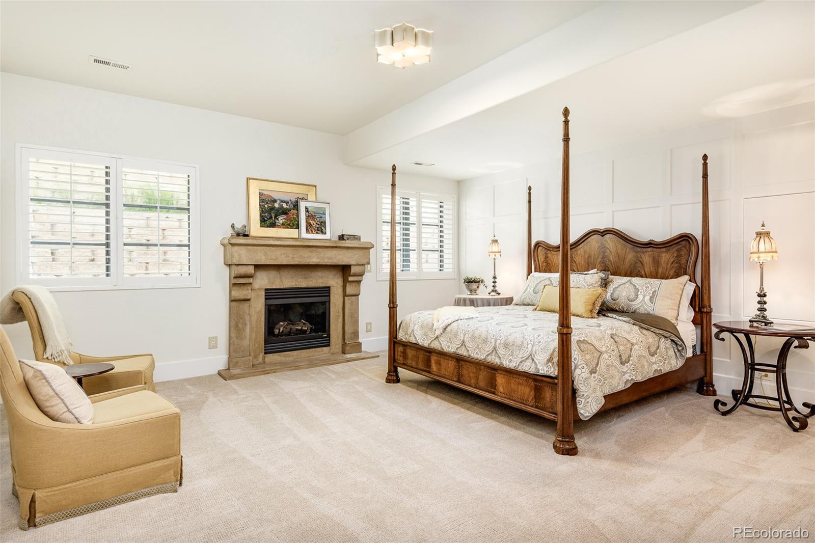 80 South Eudora Street Denver, CO 80246 - Photo 37 of 43 a bedroom with a bed and a fireplace