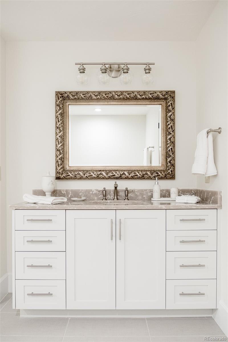 80 South Eudora Street Denver, CO 80246 - Photo 38 of 43 a bathroom with a granite countertop sink and a mirror
