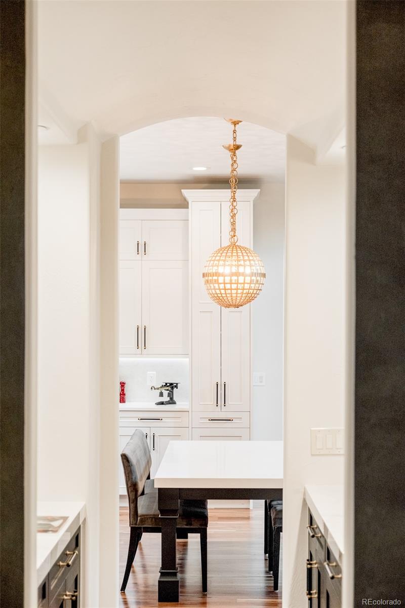 80 South Eudora Street Denver, CO 80246 - Photo 10 of 43 a room with a table chairs and chandelier