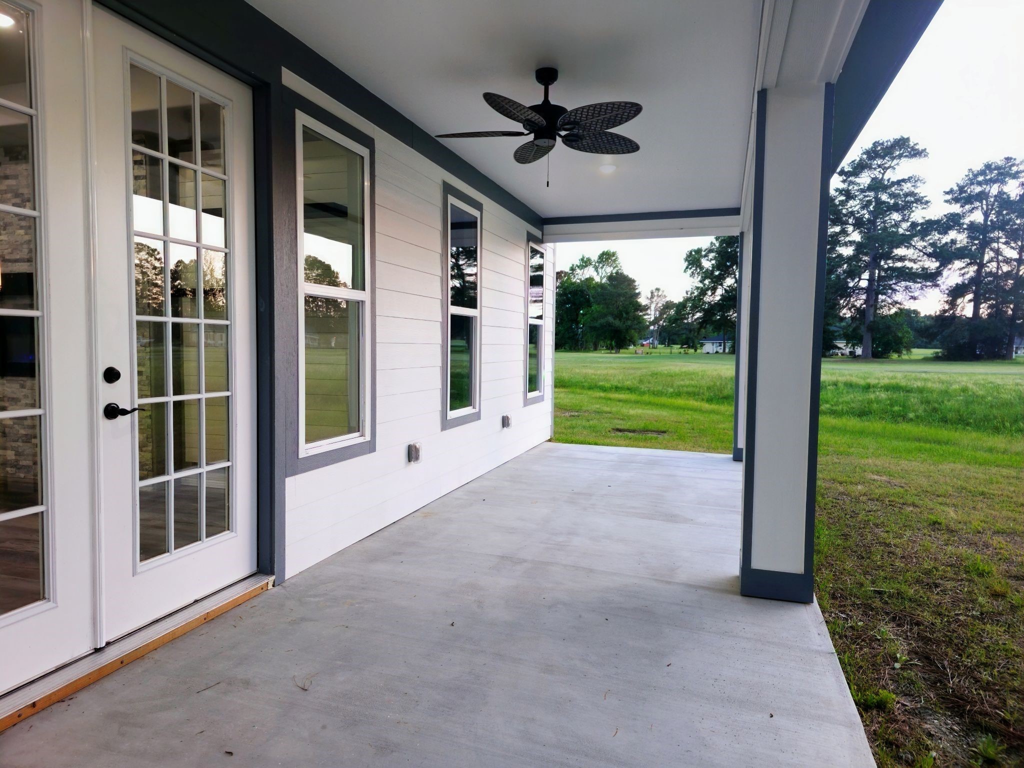 20 Lazy Springs Trinity, TX 75862 - Photo 35 of 37 Covered patio with a ceiling fan, French doors, and a view of the golf course.