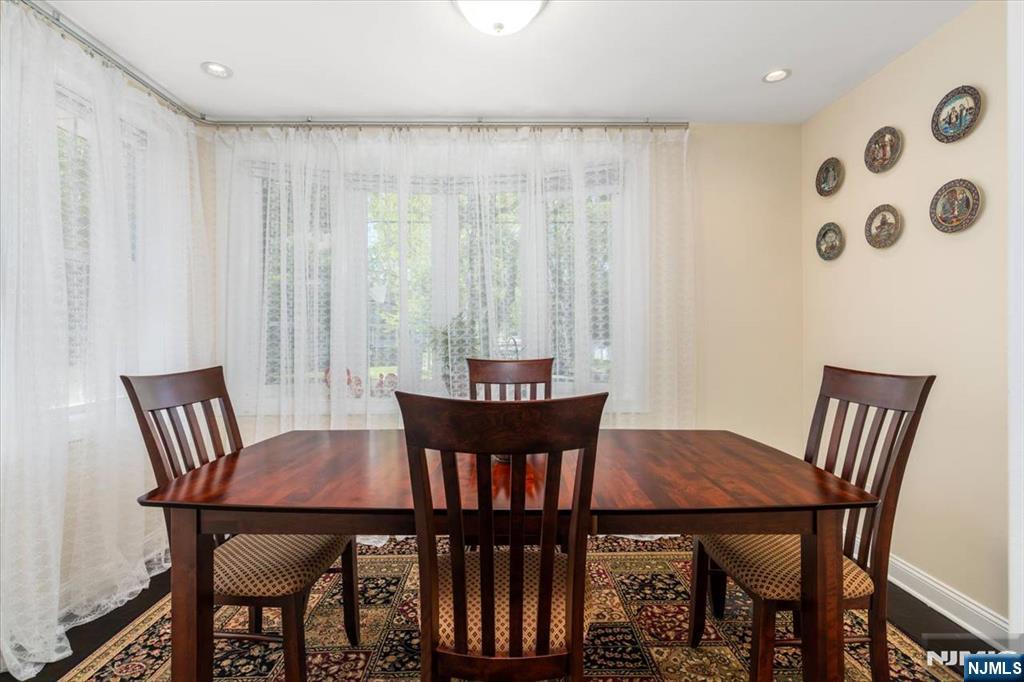 65 Lincoln Avenue Rutherford, NJ 07070 - Photo 14 of 39 a view of a dining room with furniture and wooden floor