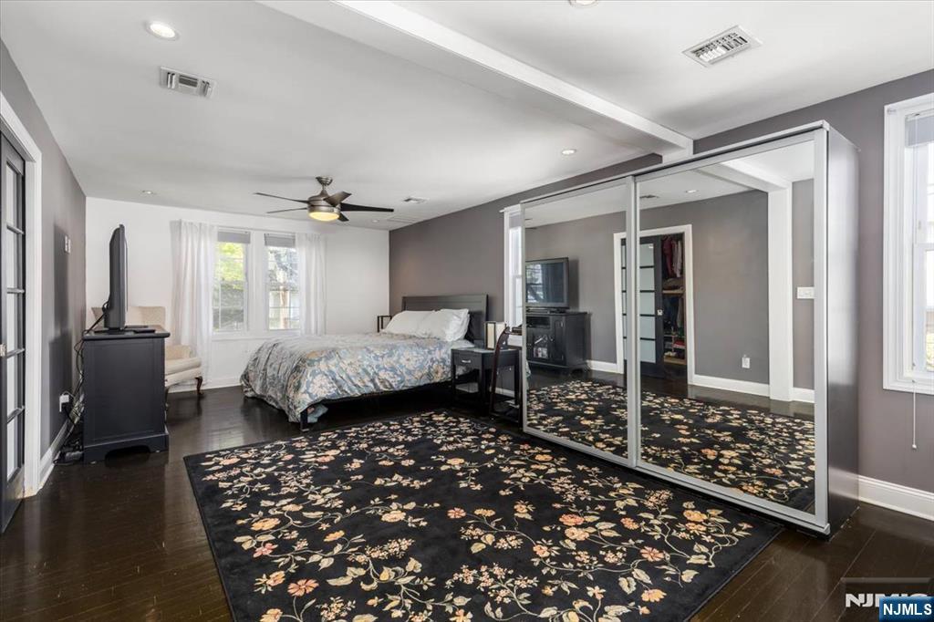 65 Lincoln Avenue Rutherford, NJ 07070 - Photo 17 of 39 a bedroom with furniture and wooden floor
