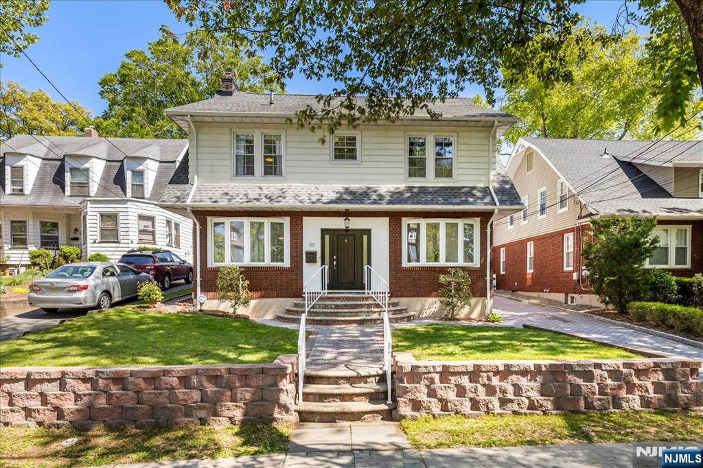 65 Lincoln Avenue Rutherford, NJ 07070 - Photo 2 of 39 a front view of a house with garden