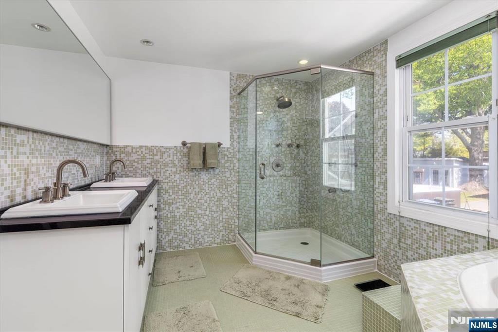65 Lincoln Avenue Rutherford, NJ 07070 - Photo 21 of 39 a bathroom with a sink a toilet and bathtub