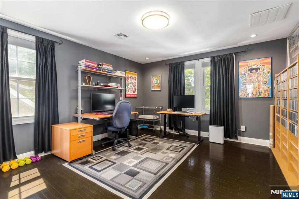 65 Lincoln Avenue Rutherford, NJ 07070 - Photo 24 of 39 a living room with furniture and a flat screen tv