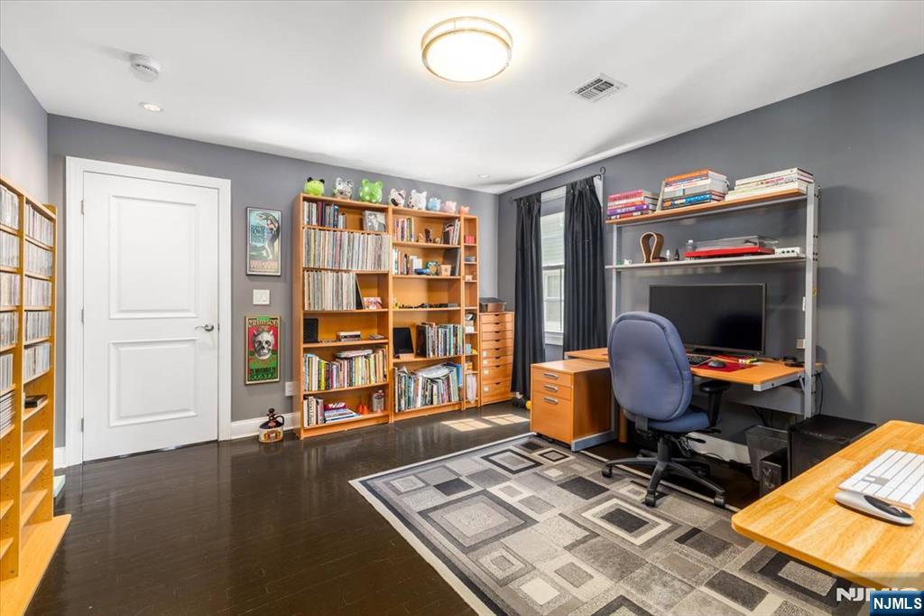 65 Lincoln Avenue Rutherford, NJ 07070 - Photo 25 of 39 a room with furniture and gym equipment