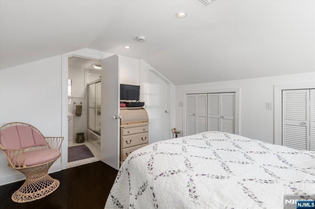 65 Lincoln Avenue Rutherford, NJ 07070 - Photo 29 of 39 a spacious bedroom with a bed and furniture