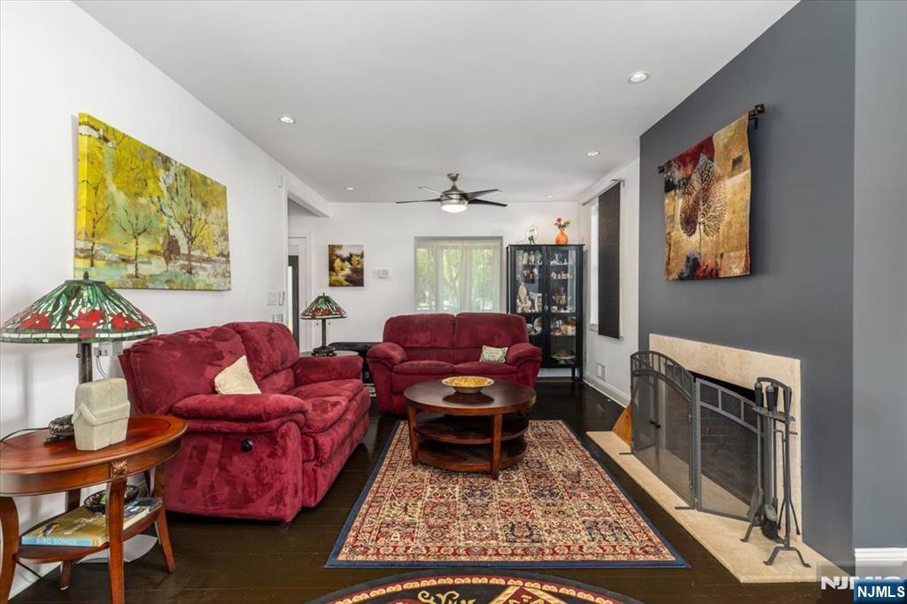 65 Lincoln Avenue Rutherford, NJ 07070 - Photo 6 of 39 a living room with furniture a rug and a fireplace