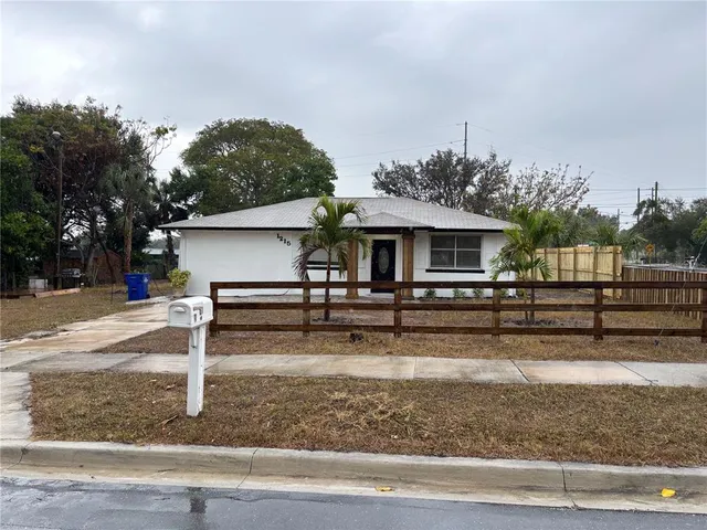 front view of house with wooden stairs