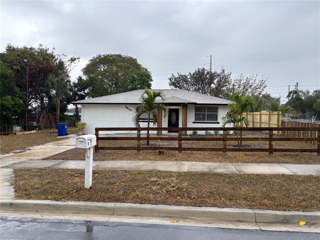 front view of house with wooden stairs