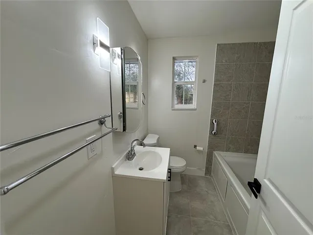 a bathroom with a sink and shower