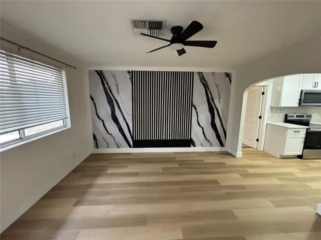 a view of an empty room with a window