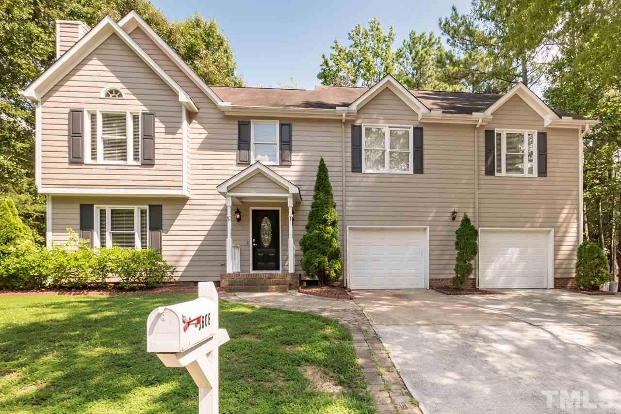 3608 Singleleaf Lane Raleigh, NC 27616 - Photo 1 of 23 a front view of a house with a yard and garage
