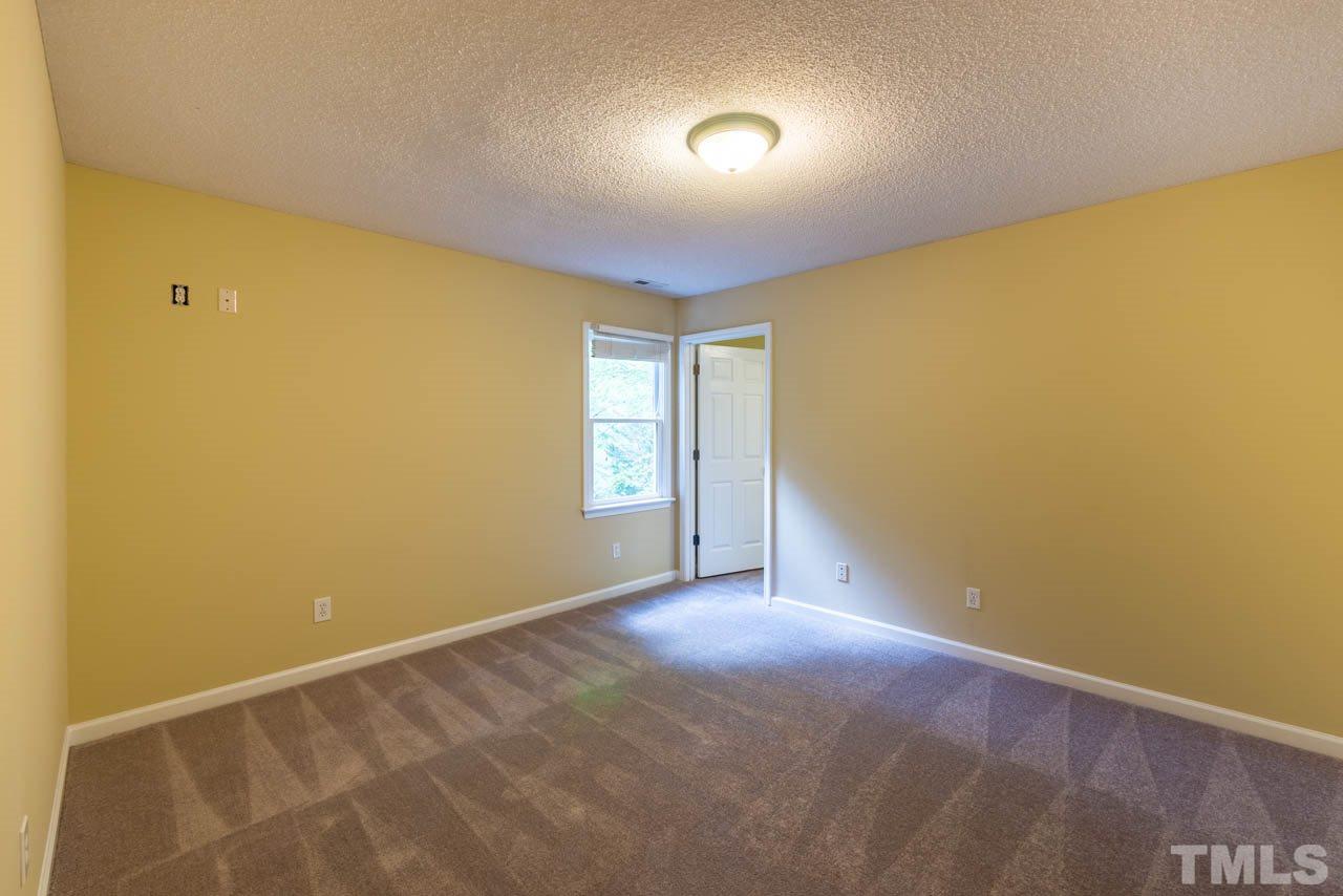 3608 Singleleaf Lane Raleigh, NC 27616 - Photo 12 of 23 an empty room with windows