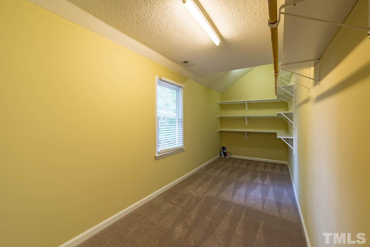 3608 Singleleaf Lane Raleigh, NC 27616 - Photo 13 of 23 a view of an empty room with a window and wooden floor