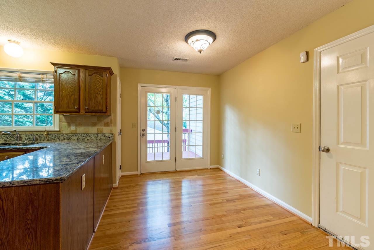 3608 Singleleaf Lane Raleigh, NC 27616 - Photo 5 of 23 a kitchen with granite countertop a sink and a stove