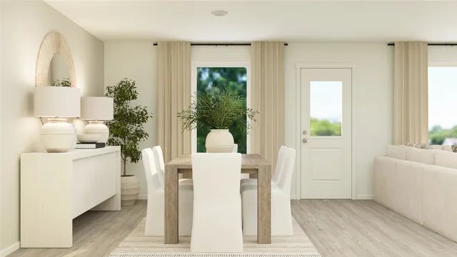 a view of kitchen with furniture and wooden floor
