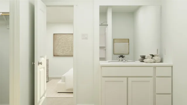 a bathroom with a sink and mirror with toilet