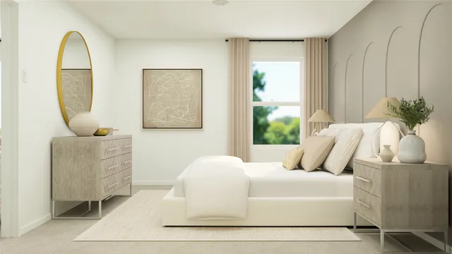 a bedroom with a bed and a painting on the wall