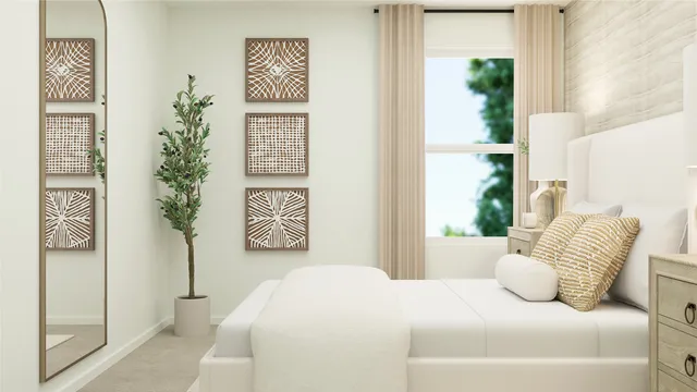 a bedroom with a bed and a potted plant