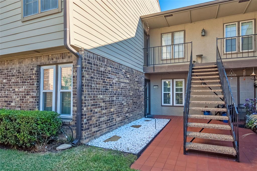 5300 Keller Springs Road, Unit 1048 Dallas, TX 75248 - Photo 36 of 38 A staircase of the two-story apartment building.