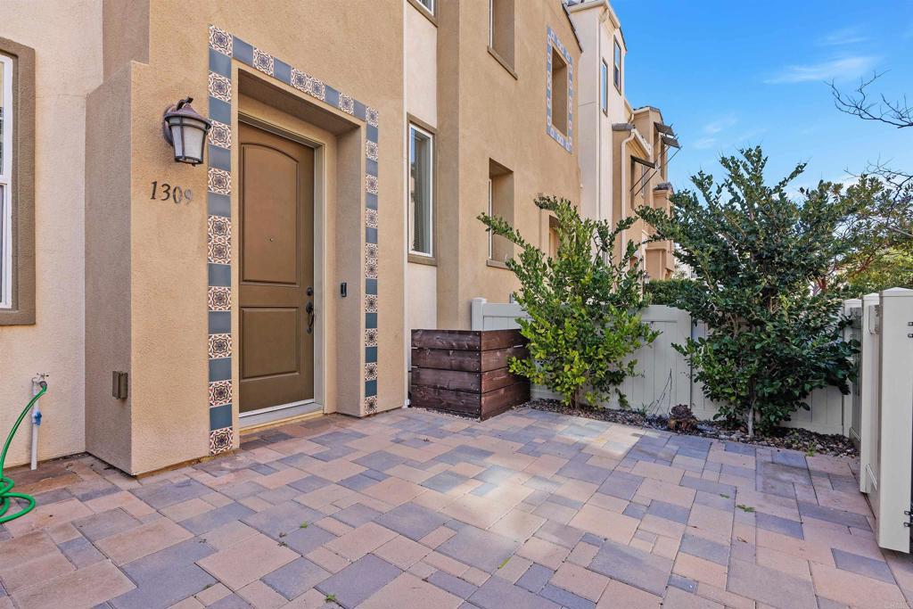 1309 Via Lucero Oceanside, CA 92056 - Photo 2 of 50 a view of a house with a backyard and pathway
